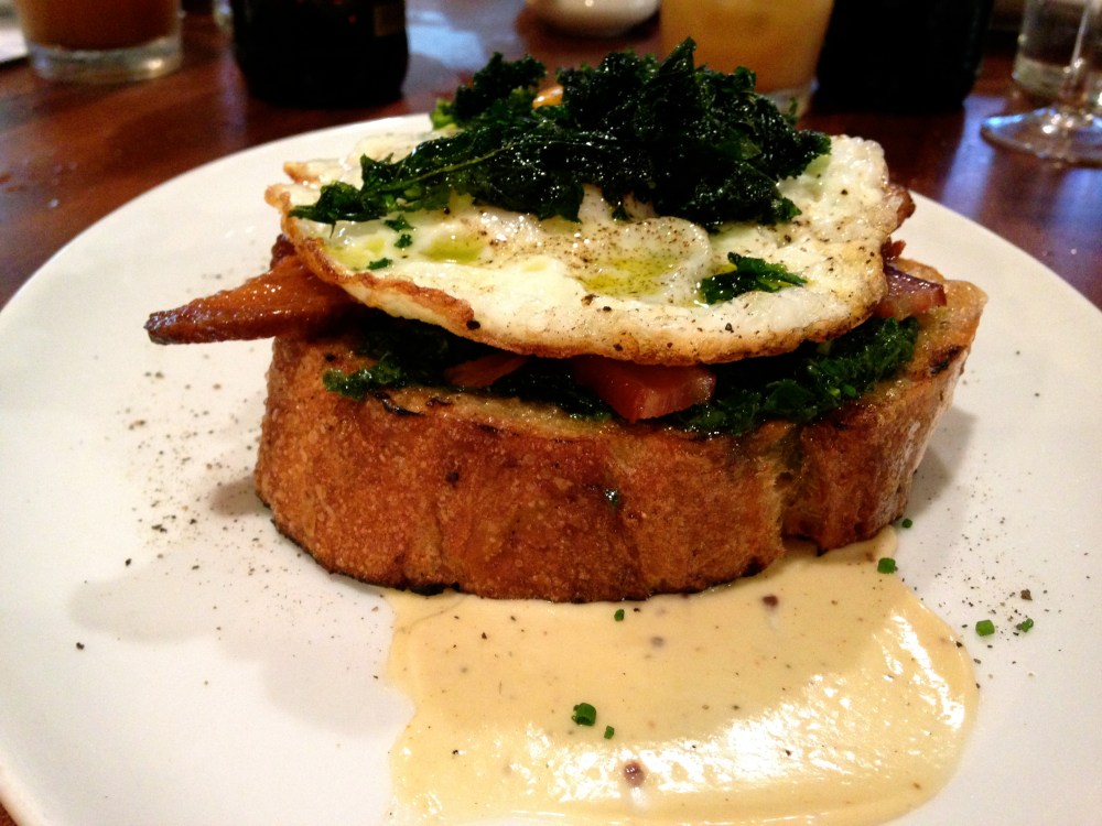 Kale Toasts with anchovy aioli and Benton's bacon for brunch at Alden & Harlow.