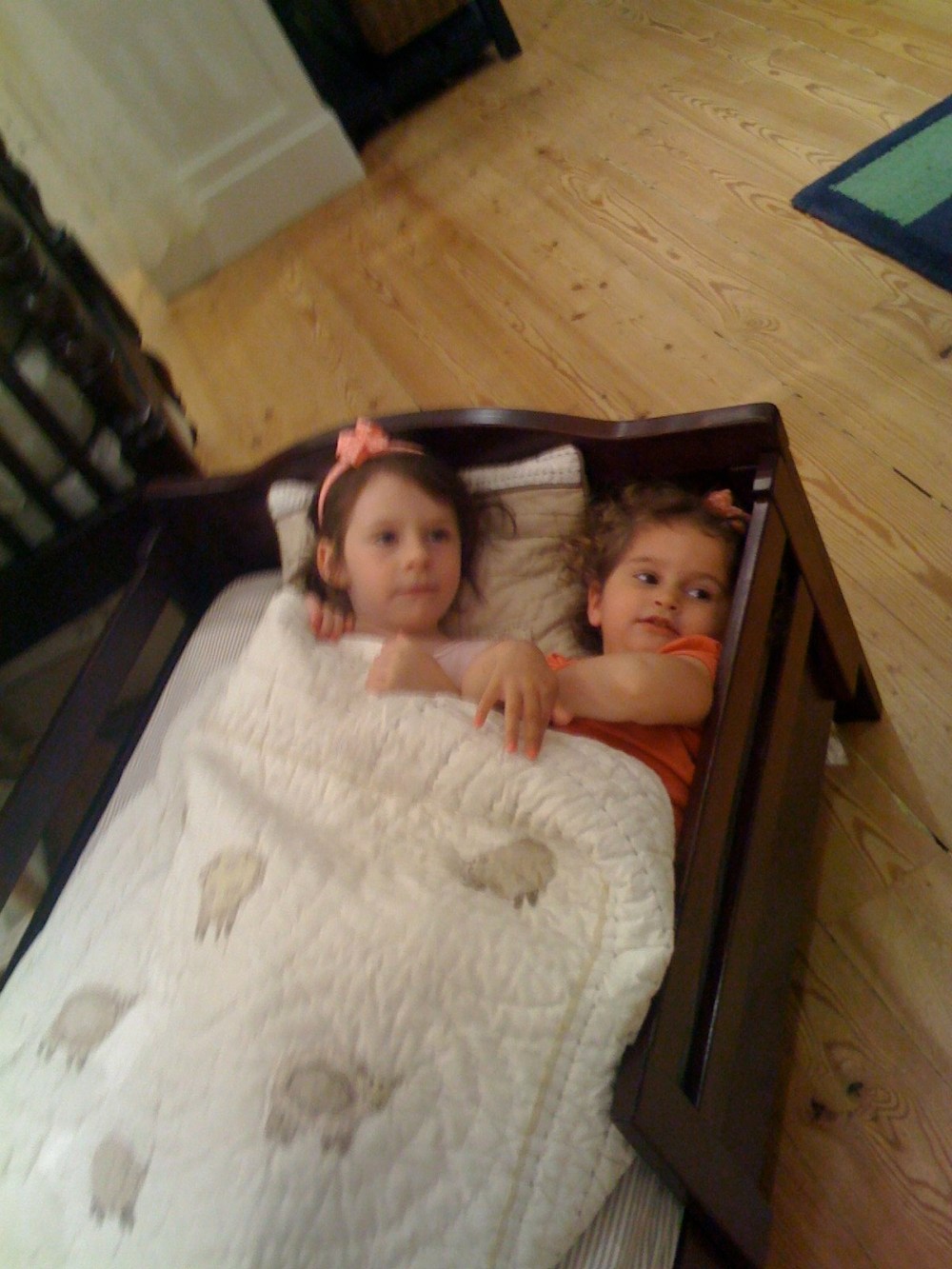 Sydney and Isabelle testing out beds at Pottery Barn Kids.
