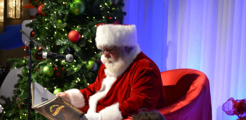 Santa reading at the Royal Sonesta Santa breakfast.  Photo courtesy of the Royal Sonesta Boston