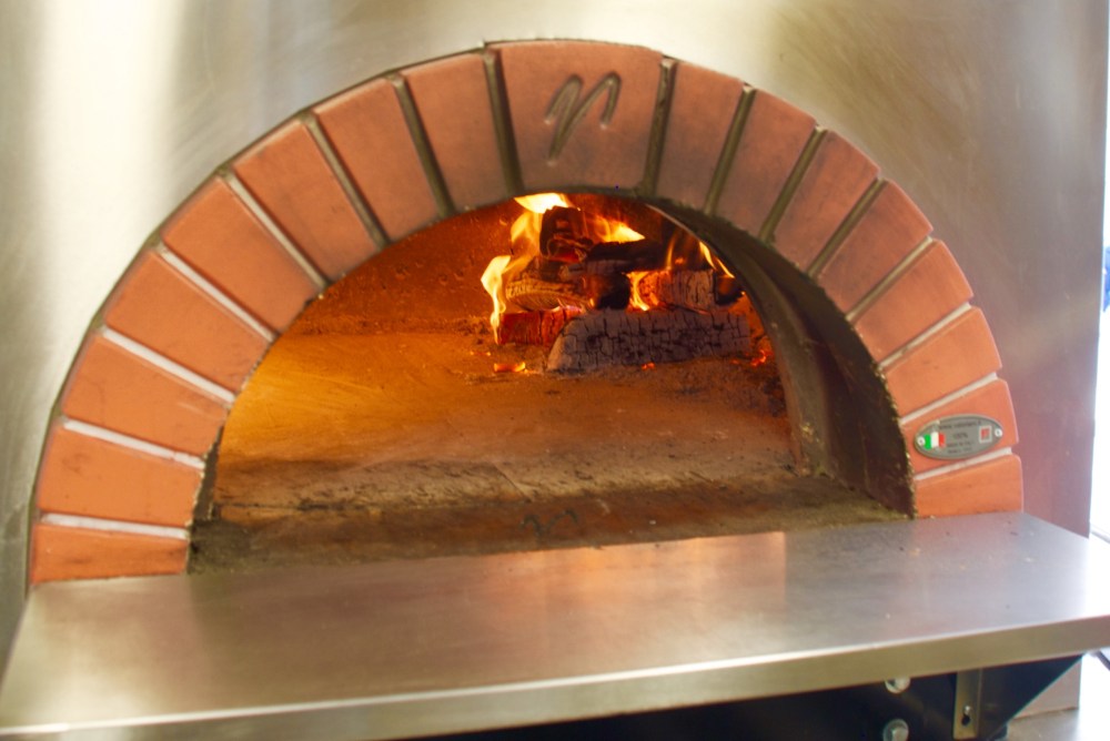 Wood fire stove on Posto Mobile's truck. 