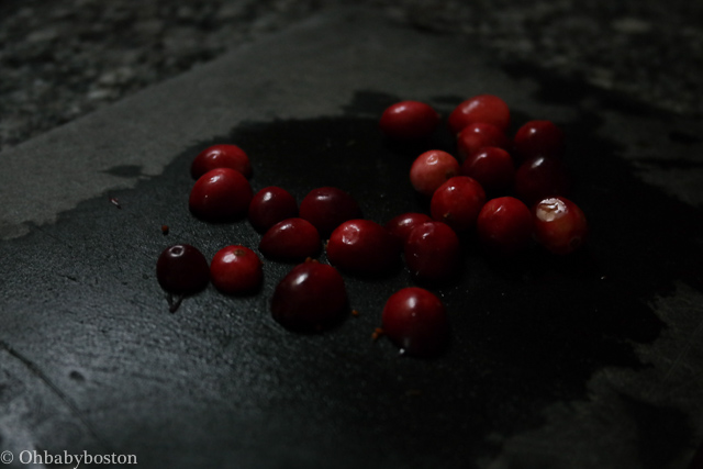Halving the cranberries will help you keep all your fingers as they will not roll as you mince them. 